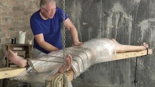 Bound young twink enjoys handjob from mature master